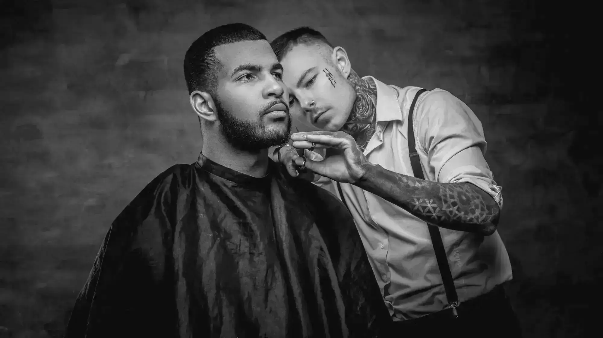 Barber demonstrating fade technique