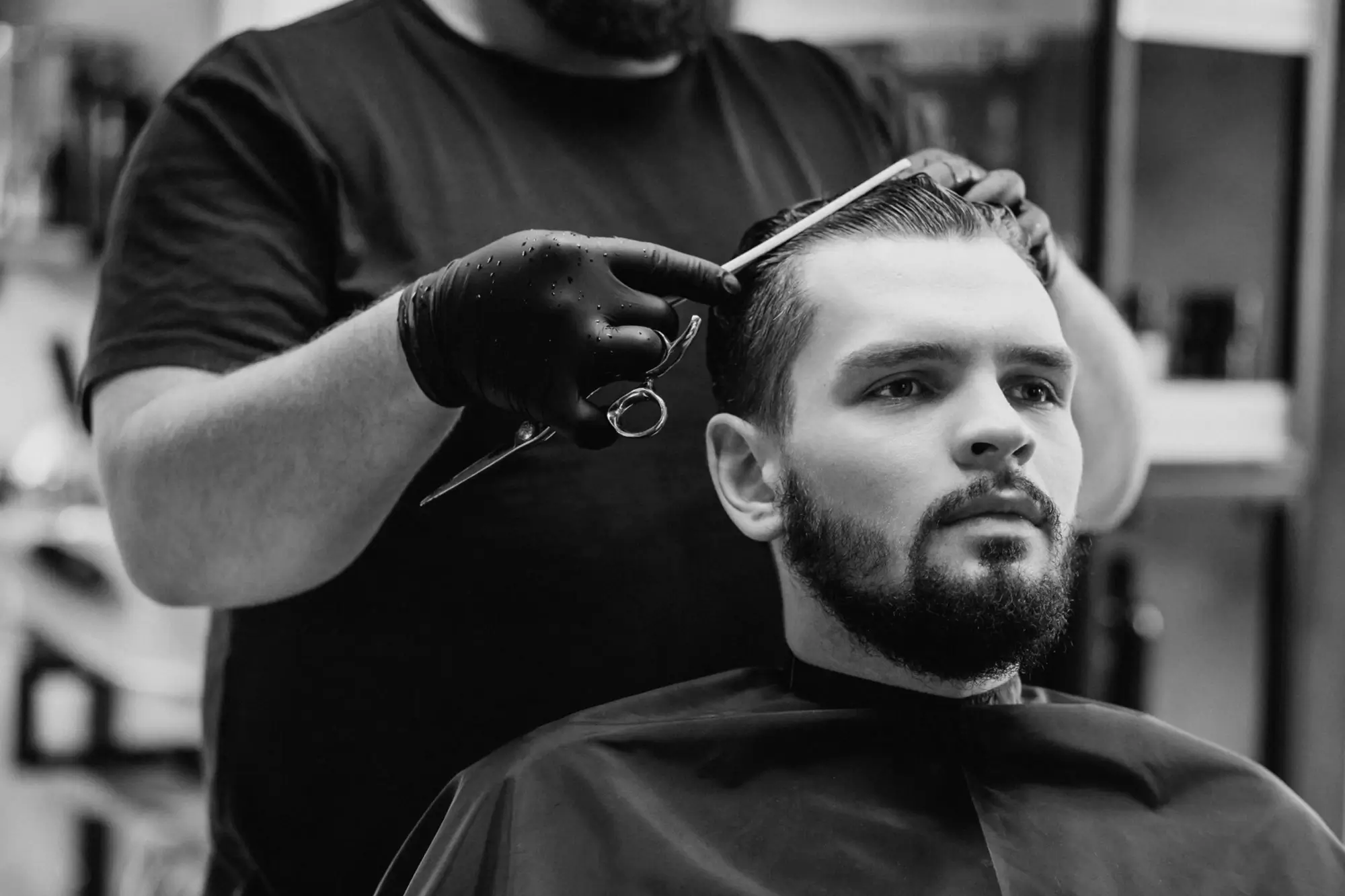 Barber demonstrating a precision haircut