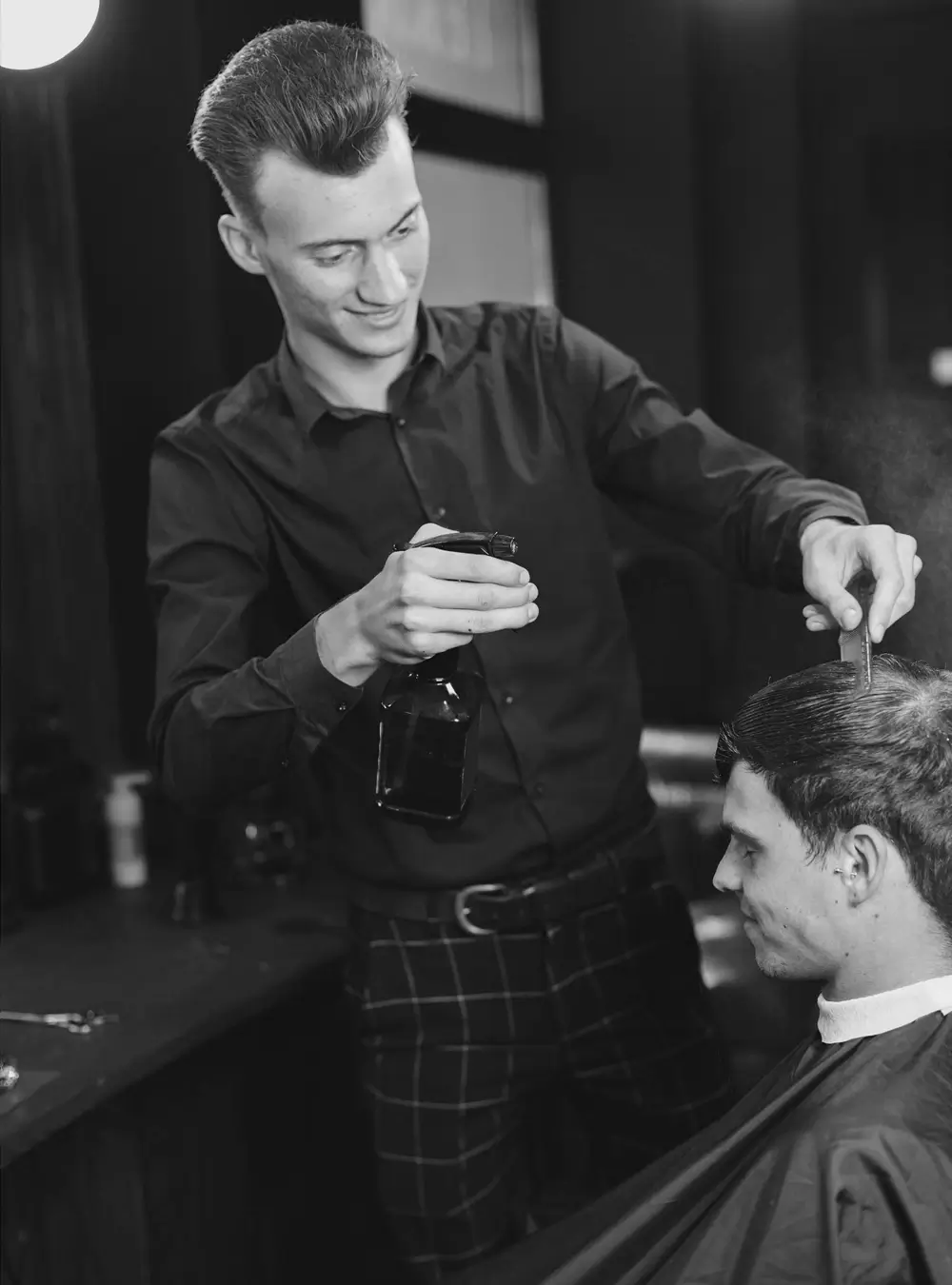 Barber concentrating on careful clipper work