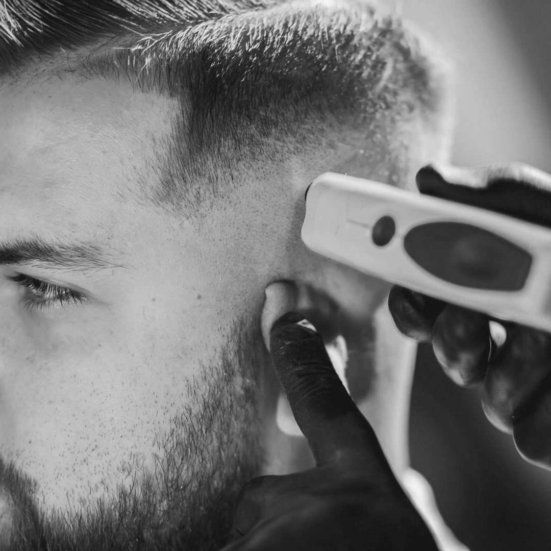 Close view of clipper work around a haircut
