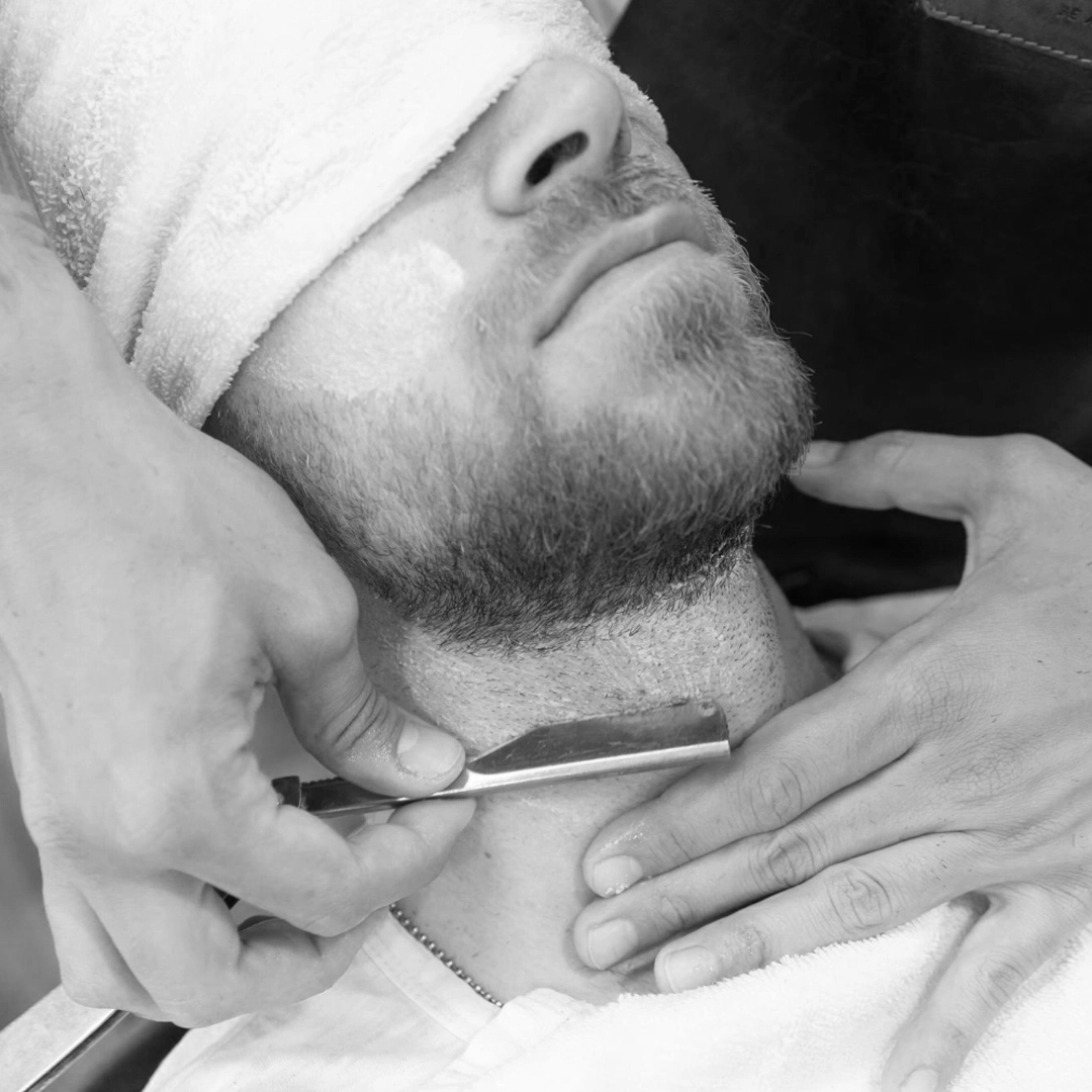 Barber preparing for precise razor work